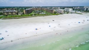 beach with residential area in background image